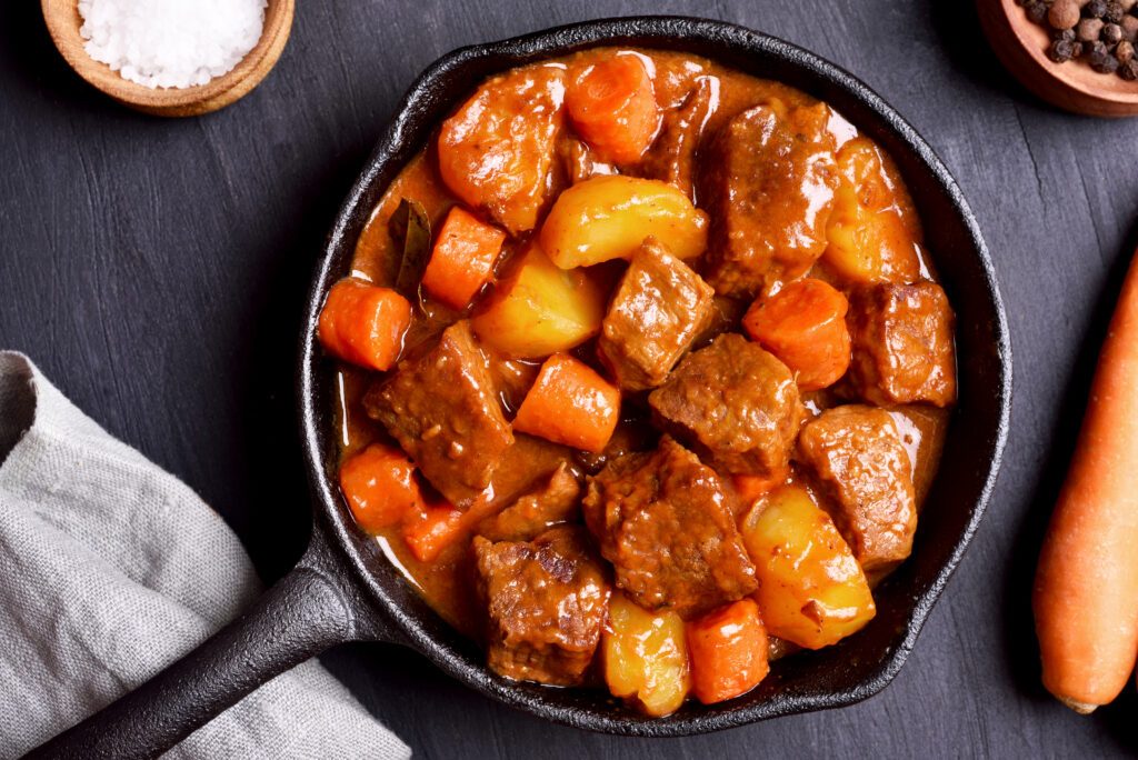 beef stew on black background